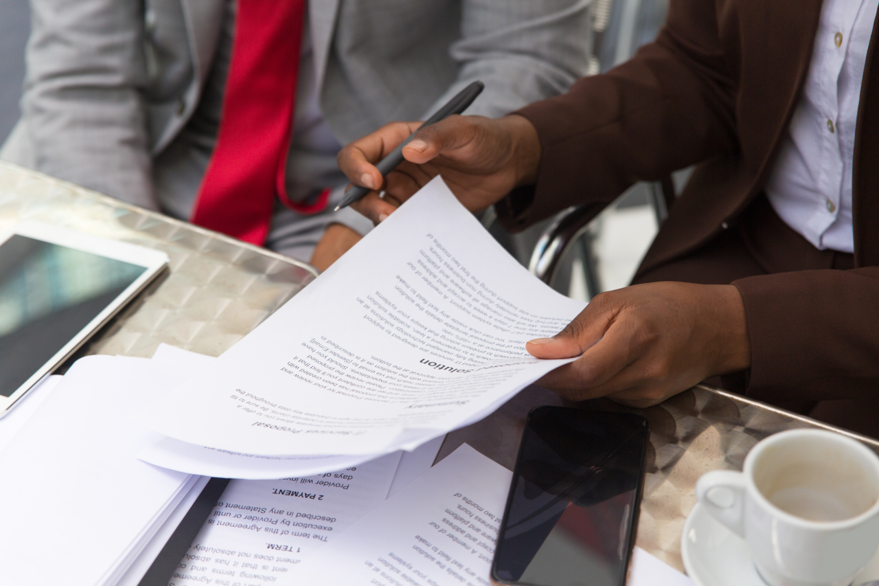 Tenant holding ID and rent documents